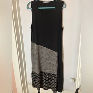 ALEMBIKA black jumper, two fabrics add detail . Pockets and stretch jersey XL.